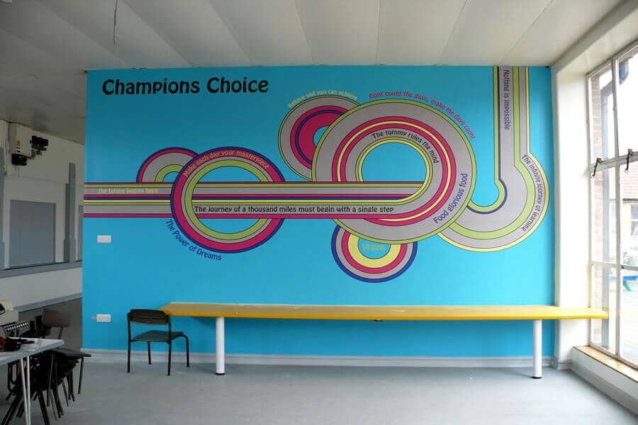 An image of colorful, circular wall graphics with quotes.